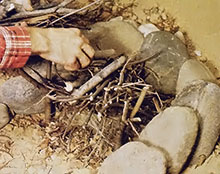 Step two: Add sticks and small branches to serve as kindling.